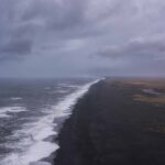 view over the black sand beach and ocean from Dyrhólaey cliffs in south Iceland