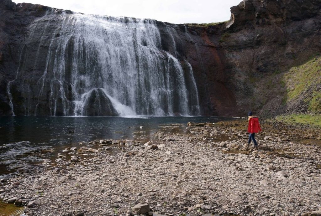 woman standing in front of Þórufoss waterfall in the Golden Circle in Iceland