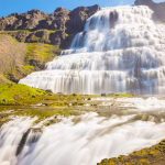 two people standing in front of Dynjandi Westfjords Iceland, Cruise ship tour to Dynjandi waterfall, Isafjordur cruise tour, Isafjordur shore excursion